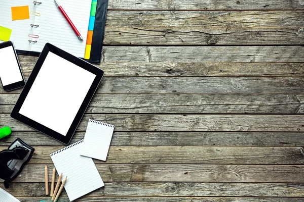 Blank display of tablet in hipster office