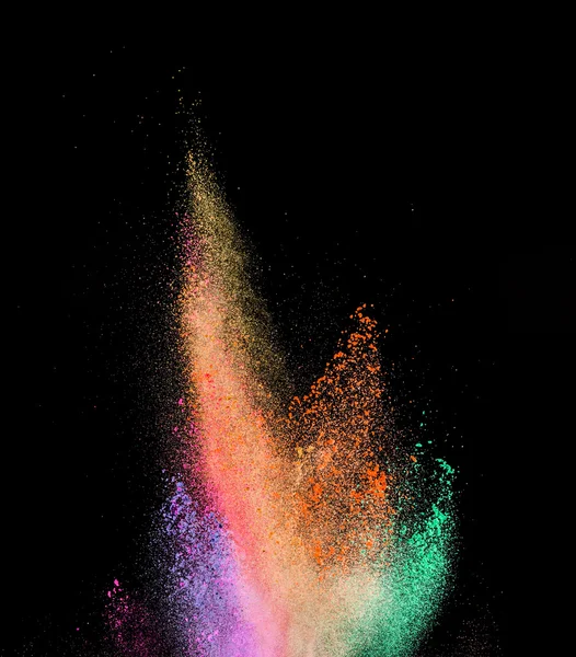 Explosion of colored powder on black background