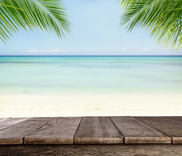 Empty wooden planks with blur beach on background