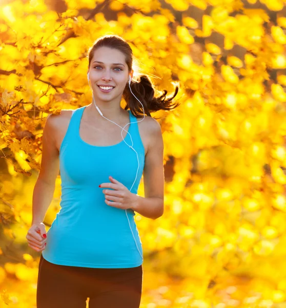 Young woman portrait, running in morning sun