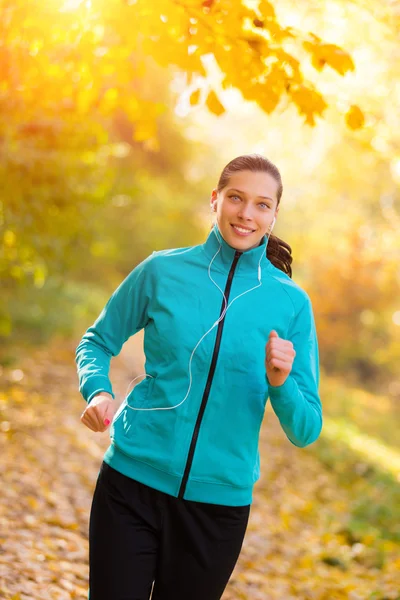 Young woman portrait, running in morning sun