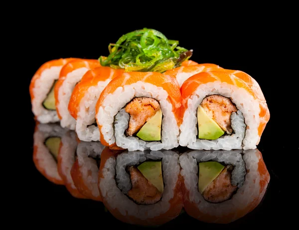 Sushi pieces on black background