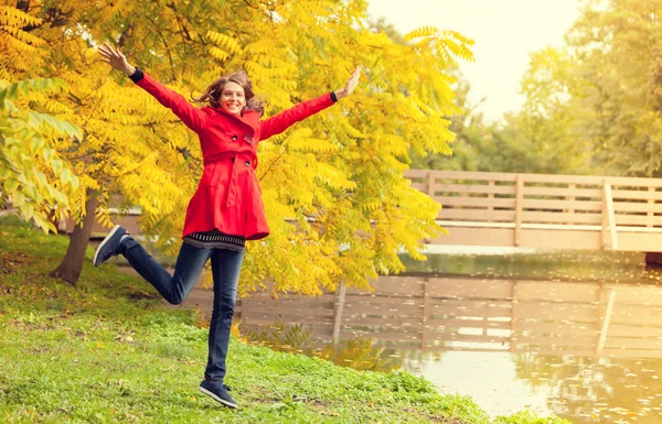 Young woman in autumn forest