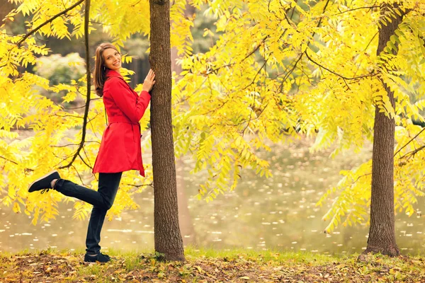 Young woman in autumn forest