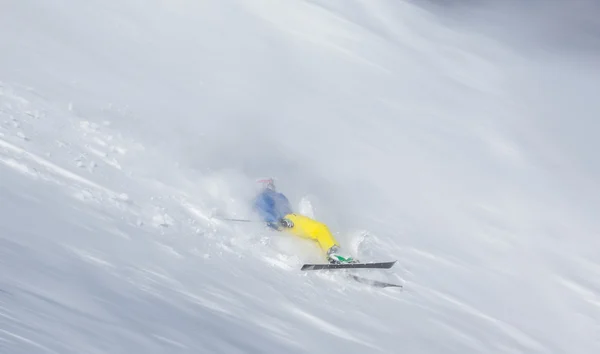 Skier falling on the slope