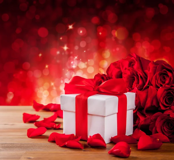 Valentines gift box on abstract red background