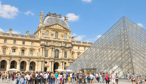 Tourists at Louvre Museum in Paris, France