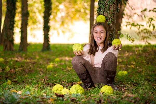 Adorable little girl outdoors at beautiful autumn day