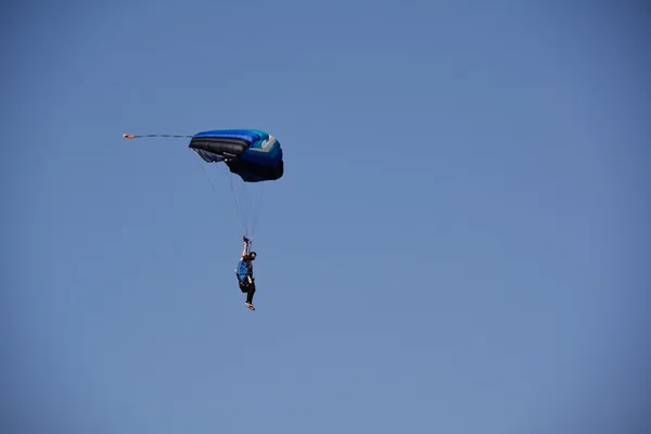 Parachuting man, side view