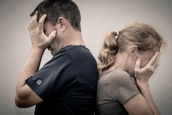 Portrait of unhappy couple not speaking after having dispute