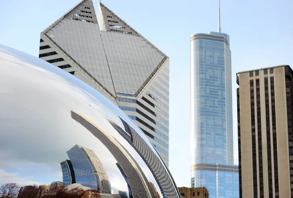 Part of Cloud Gate and Chicago skyline on April 23, 2015 in Chicago, Illinois. Cloud Gate is the artwork of Anish Kapoor as the famous landmark of Chicago in Millennium Park.