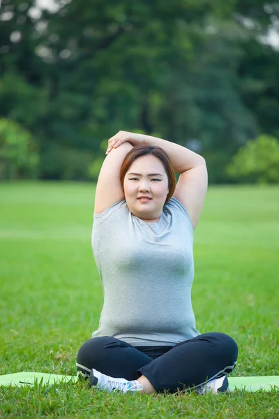 Happy fatty woman posing outdoor
