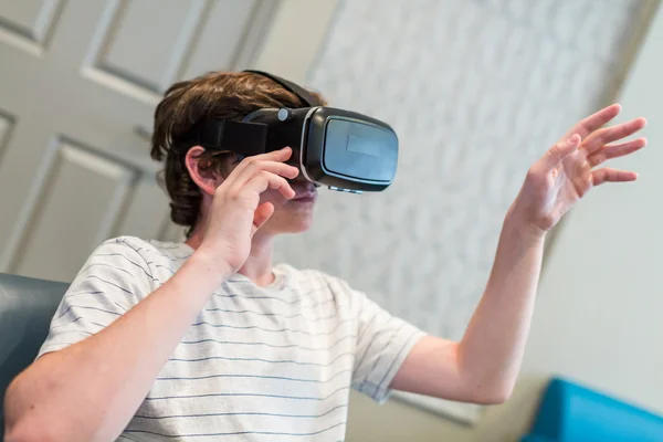 Teenage boy and VR goggles