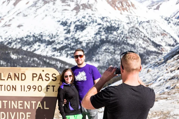 People take pictures at Loveland pass