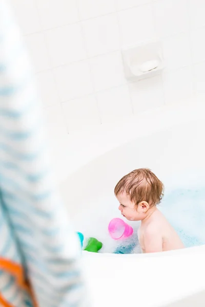 Baby girl having a bath