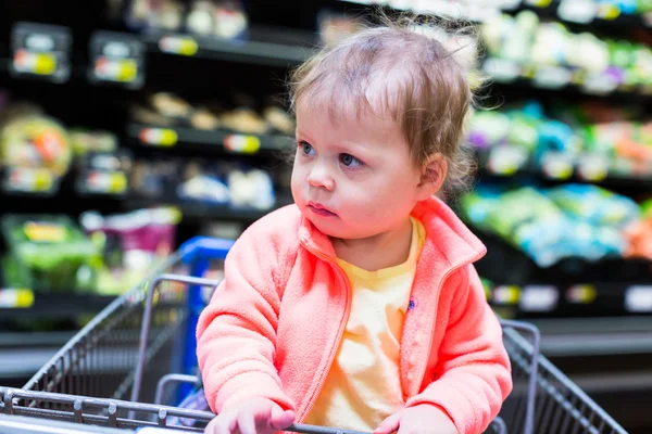 Toddler girl at the grocery store.