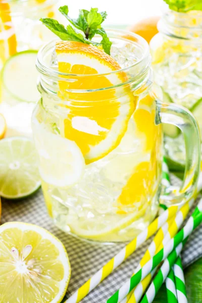 Water with fresh citrus fruits and ice