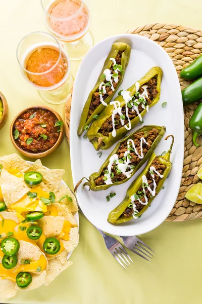 Chipotle beef and bean stuffed chile peppers