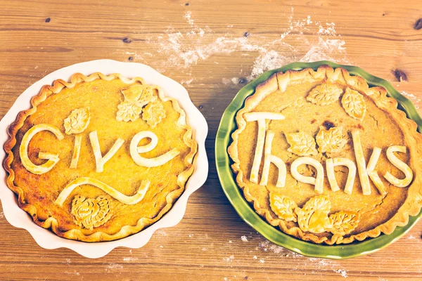 Pumpkin pies with Give Thanks sign