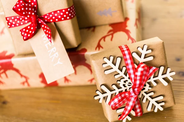 Christmas gifts wrapped in brown paper