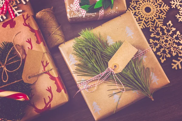 Christmas gifts wrapped in brown paper