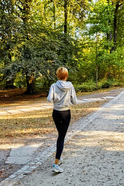 Anorexic woman running in park