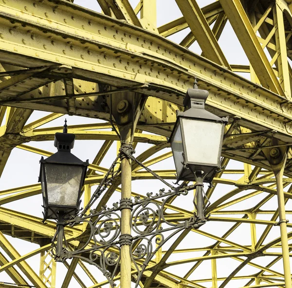 Decorative lamps hanging from bridge
