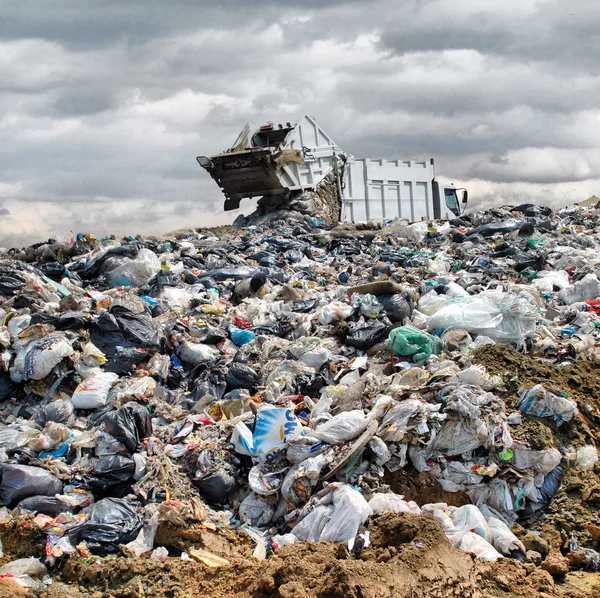 Garbage truck unloading at the dump