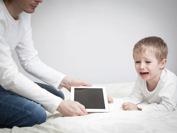 Computer addiction, parent taking out touch pad from child