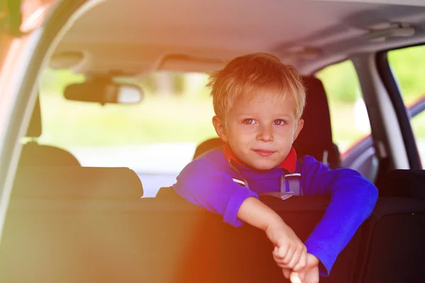 Little boy travel by car, family tourism