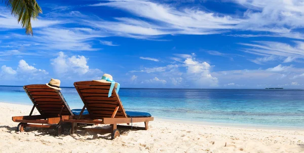 Two chairs on the tropical beach