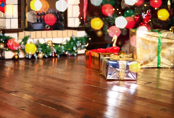 Christmas presents in living room under new year tree