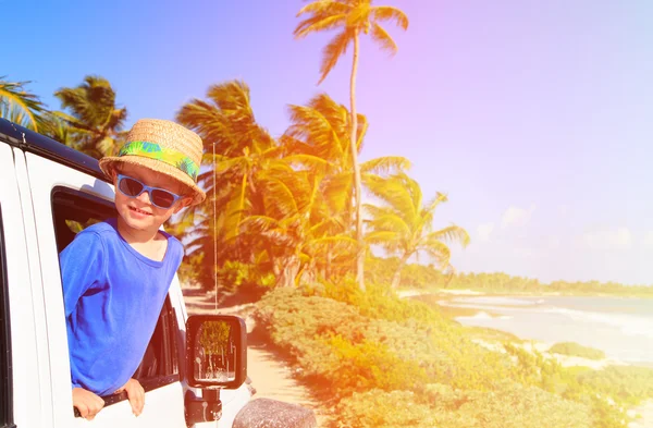 Little boy in off road car, family vacation