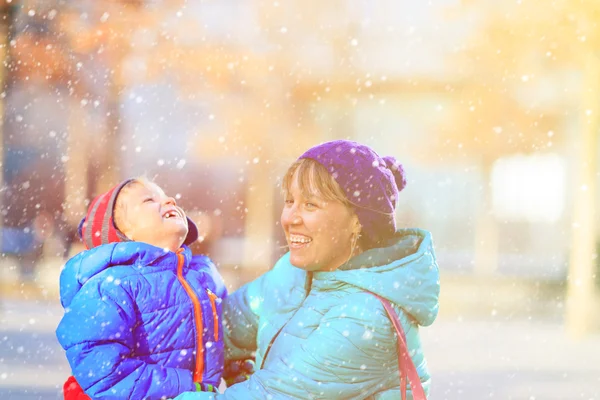 Mother and son enjoy winter in the city