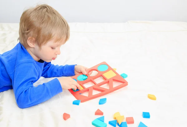 Little boy learning shapes