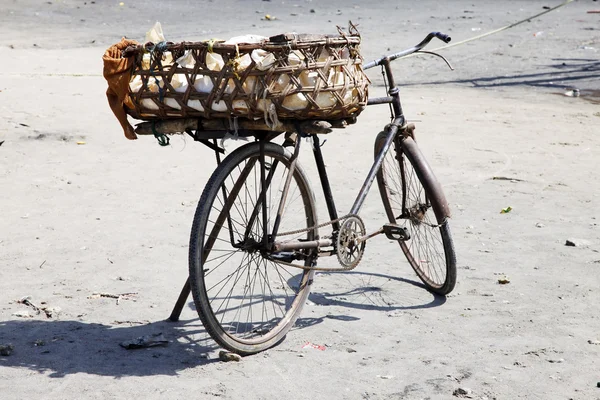 Old rusty bicycle with a basket