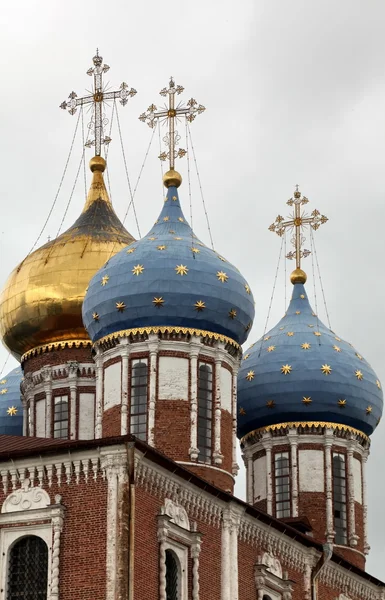 Cross and gold stars on the church dome