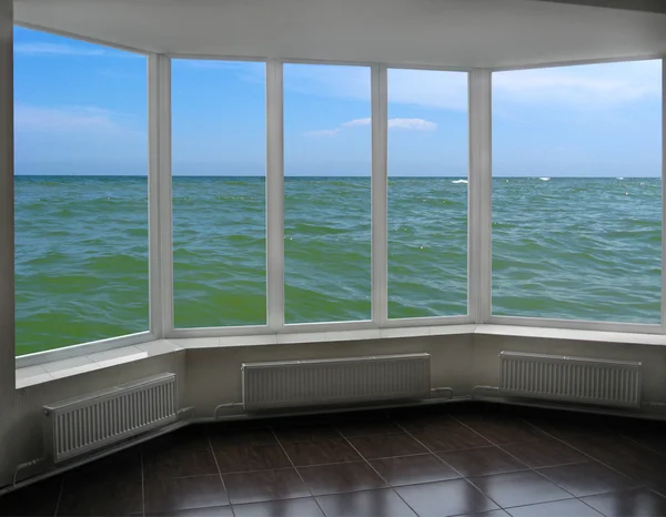 Plastic window with view of marine waves
