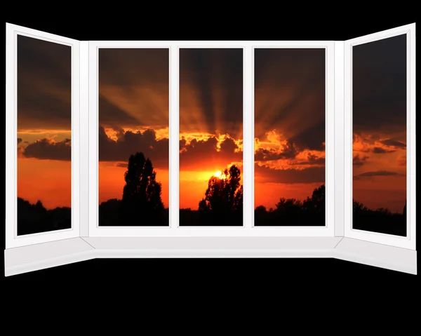 Big plastic windows with beautiful sunset beyond it