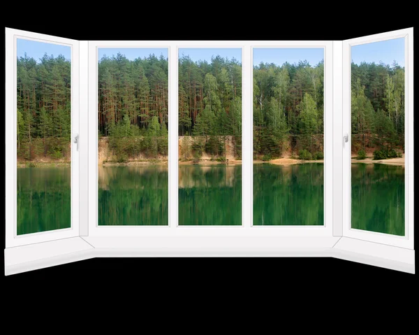 Modern window to the summer forest lake