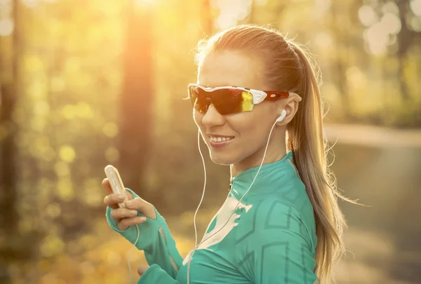 Runner in action listening to music