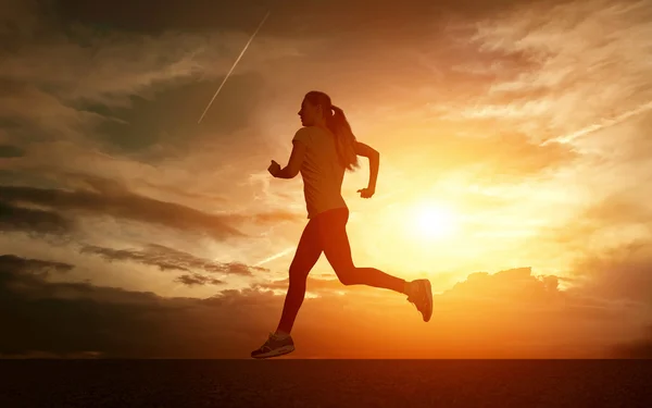 Beautiful silhouette of female running