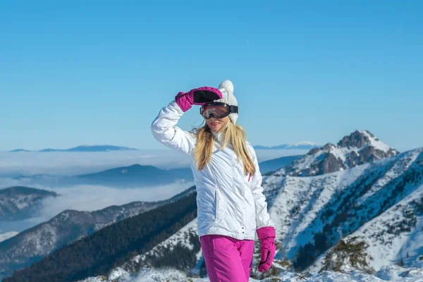 Female stay on the top of mountain