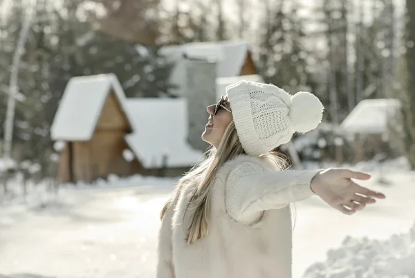 Happy  female near the winter villa