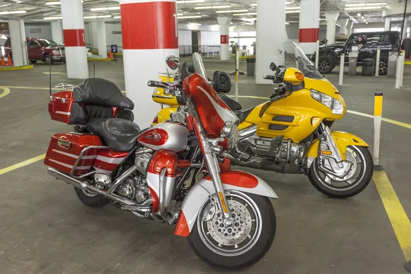Motorcycles in a parking garage