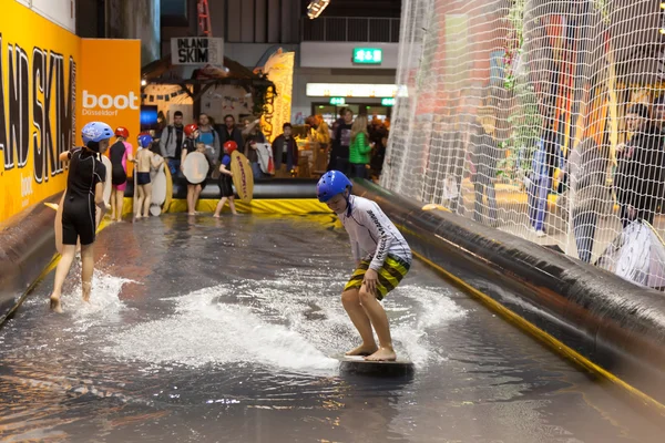 Boot Duesseldorf 2015 - the worlds biggest yachting and water sports exhibition. January 25, 2015 in Duesseldorf, Germany. Indoor Skimboarding in the exhibition hall.