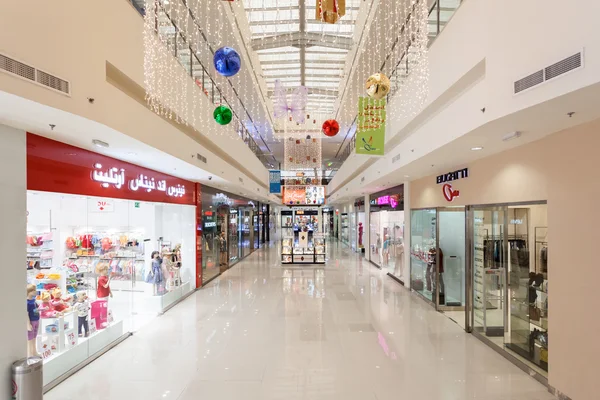 DUBAI, UAE - DEC 13: Interior of Dubai Outlet Mall. The shopping mall is part of Dubai Outlet City in Dubai. December 13, 2014 in Dubai, UAE
