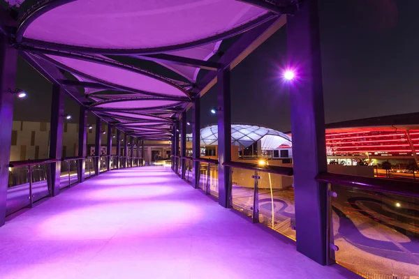 ABU DHABI - DEC 19: Ferrari World Theme Park entrance interior at night. December 19, 2014 in Abu Dhabi, United Arab Emirates