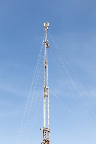 Mobile communication tower with cellular antennas