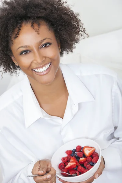 Mixed Race African American Woman Eating Fruit